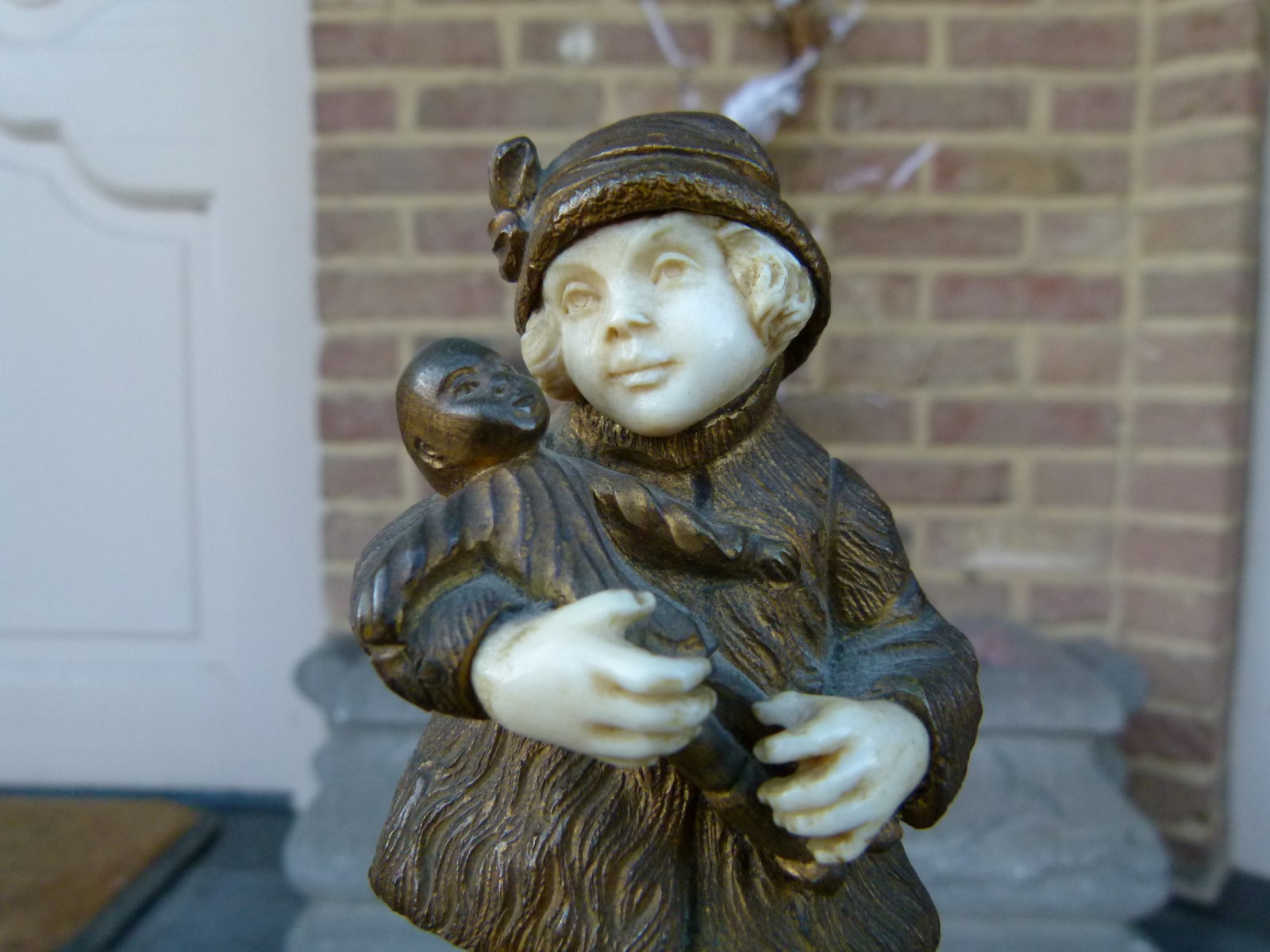 sculpture by G.Omert child with doll