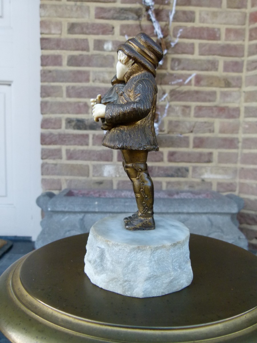 sculpture by G.Omert child with doll