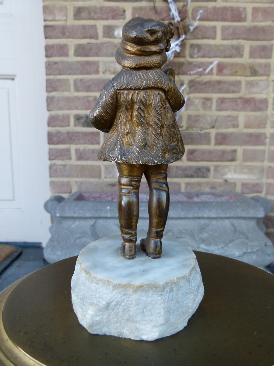 sculpture by G.Omert child with doll