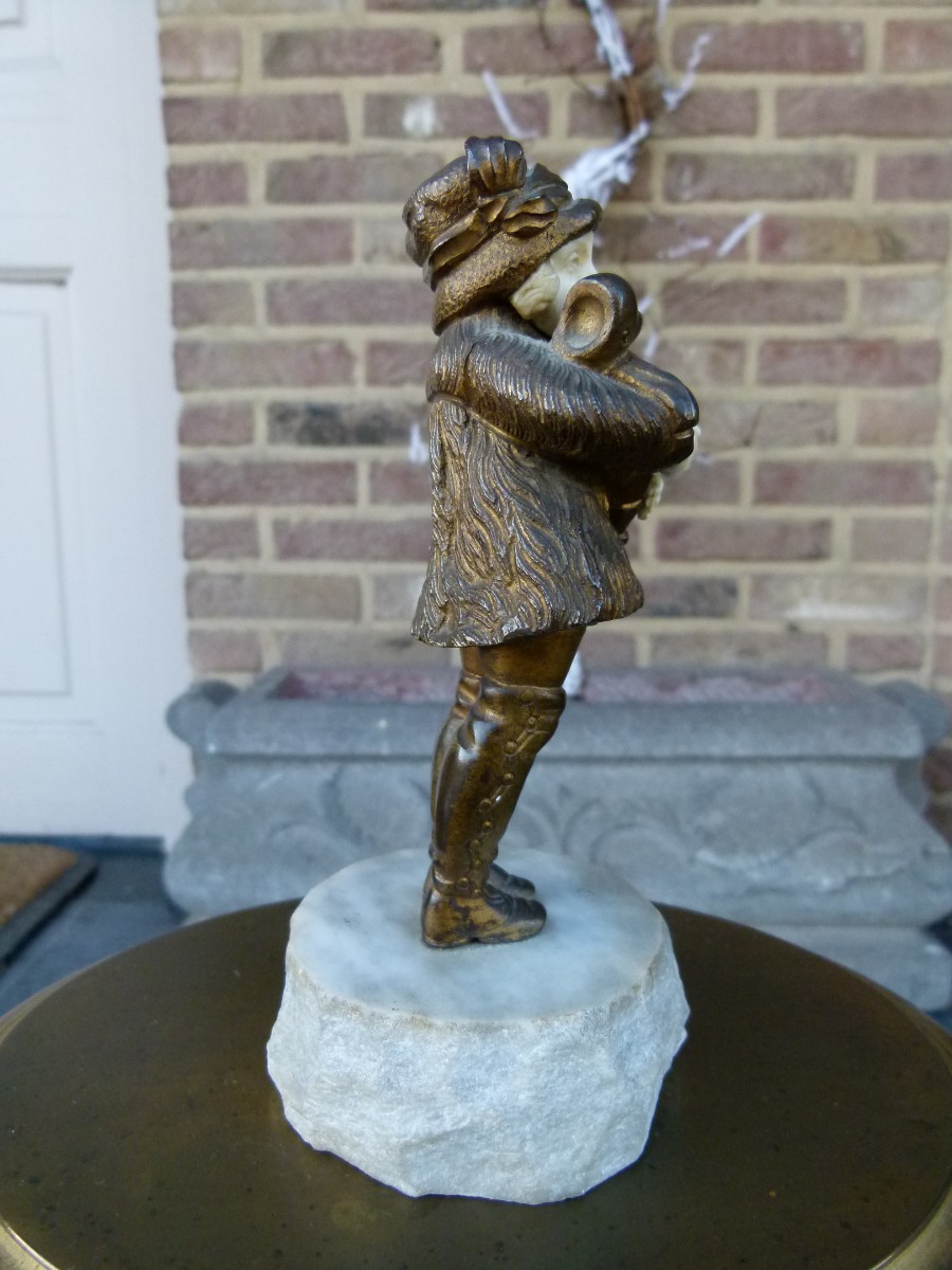 sculpture by G.Omert child with doll