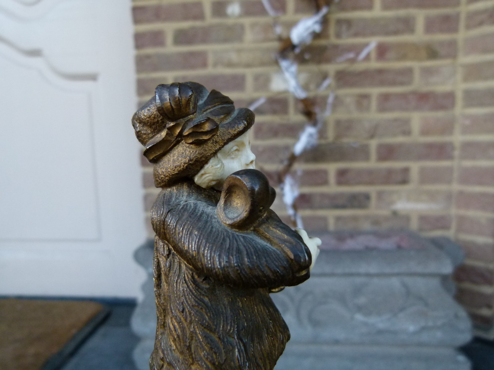 sculpture by G.Omert child with doll