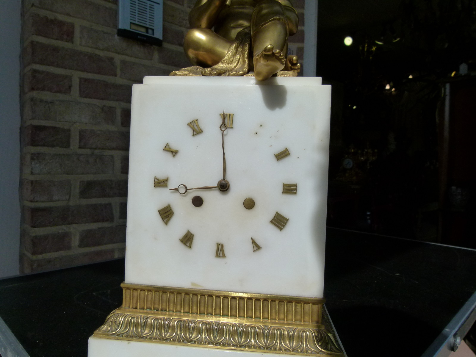 Charles X Clock with a putti playing on flutes