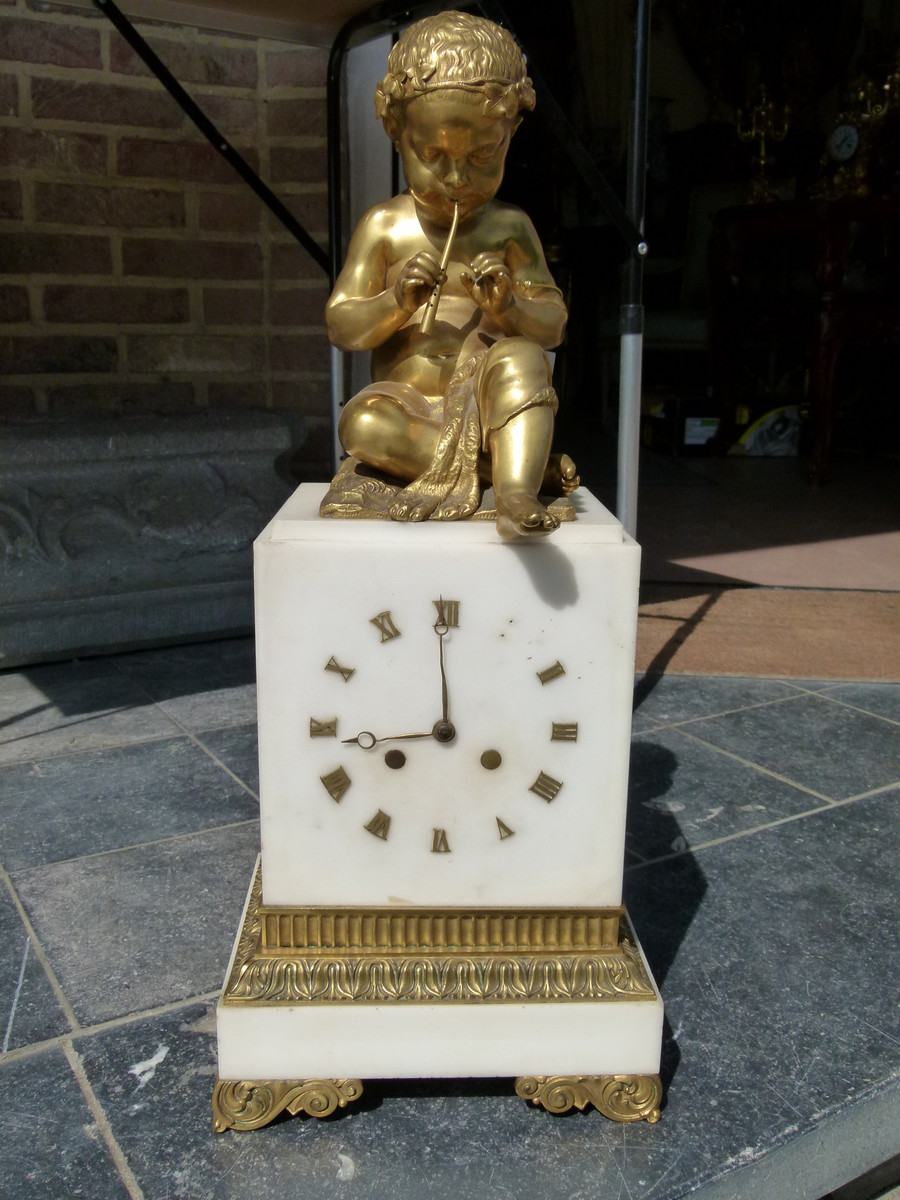 Charles X Clock with a putti playing on flutes